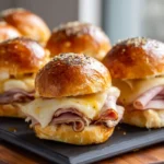 Ham & Swiss Sliders with Mustard Glaze 3 Tray of smoked turkey and Swiss sliders with poppy seed topping and melted cheese