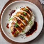 Teriyaki Chicken Breast (Stovetop) 3 Teriyaki chicken breast sliced and served over creamy mashed potatoes with sauce drizzle and green onions.