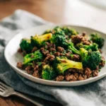 Honey Garlic Ground Beef and Broccoli 3 plated honey garlic ground beef and broccoli served on a ceramic plate with tender beef and roasted broccoli
